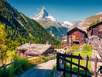 Sunny summer morning in Zermatt village with Matterhorn (Monte Cervino, Mont Cervin) peak on backgroud. Beautiful outdoor scene in  Swiss Alps, Valais canton, Switzerland, Europe.