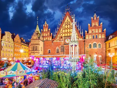 Wroclaw, Poland - December 2019:  Christmas market square. New Year ambiance, illuminated ornamented festive city. Night scene.