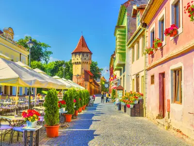 Little square and The Carpenters' Tower in Sibiu city, Transylvania region, Romania.