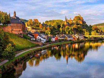 Saarburg historical Old Town on the hills in Saar river valley, Germany, in sunset light