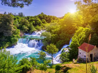 Waterfalls Krka, National Park, Dalmatia, Croatia. View of Krka National Park, Roski Slap location, Croatia, Europe. Beautiful world of Mediterranean countries. Traveling concept background.