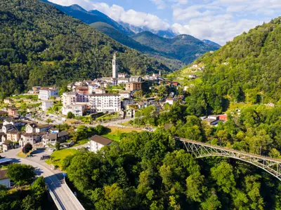 View from drone of houses of village Intragna in mountain valley in sunny summer day