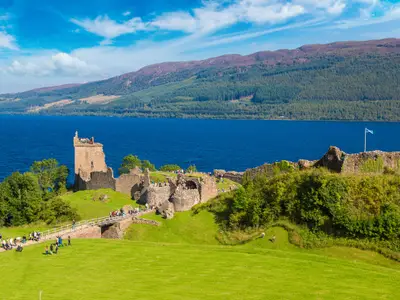 Urquhart Castle along Loch Ness lake in Scotland in a beautiful summer day, United Kingdom