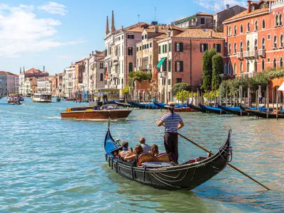 Gondola on Canal Grande in Venice, in a beautiful summer day in Italy