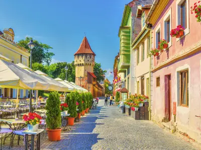 Little square and The Carpenters' Tower in Sibiu city, Transylvania region, Romania.