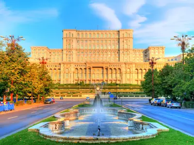 One of the famous and bigest building in the world Palace of Parliament illuminated by sunrise light in the most beautiful place of Bucharest, capital of Romania in Eastern Europe