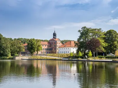 Lake and Castle of Eutin between Trees in Summer, Germany, Europe