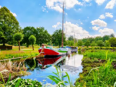 Old historic ships on a small lake near the Ottermeer in Wiesmoor, east frisia, Germany. - Alte historische Schiffe auf einem kleinen See in der Nähe vom Ottermeer