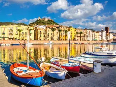 Colorful houses and boats in Bosa, Sardinia island, Italy, Europe