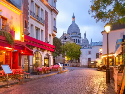 The Place du Tertre with tables of cafe and the Sacre-Coeur in the morning, quarter Montmartre in Paris, France