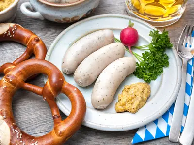 Bavarian meal. White sausages with sweet mustard and pretzels