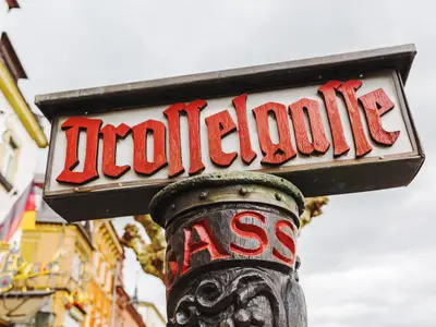 antique street name sign of the Drosselgasse in Ruedesheim, Germany