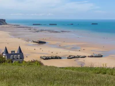 Arromanches-les-Bains beach with the remains of the Mulberry harbour in Normandy, France