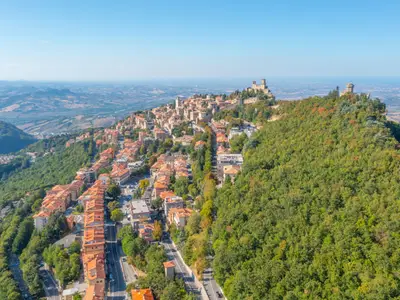 Aerial view of San Marino dominated by Torre Guaita and Torre Cesta.