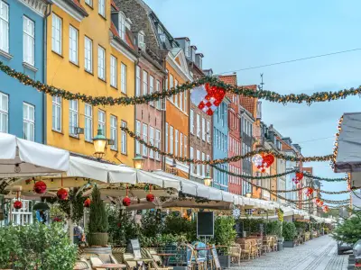 Nyhavn Waterfront With Christmas Decorations In Copenhagen, Denmark, Traditional Holiday Market