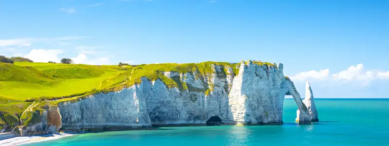Picturesque panoramic landscape on the cliffs of Etretat. Natural amazing cliffs. Etretat, Normandy, France, La Manche or English Channel. France
