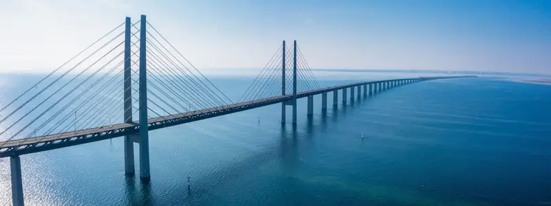Panoramic aerial view of the Oresundsbron bridge between Denmark and Sweden.. Oresund Bridge view at sunset.