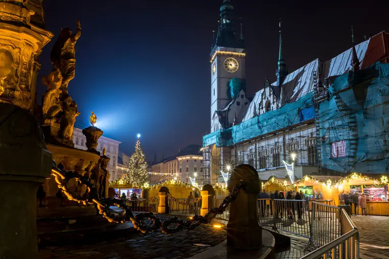 Olomouc Czech Rep 7th December Chrismas market with punch stands and the city hall with astronomical clock being repaired.