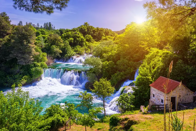 Waterfalls Krka, National Park, Dalmatia, Croatia. View of Krka National Park, Roski Slap location, Croatia, Europe. Beautiful world of Mediterranean countries. Traveling concept background.