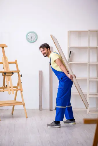 Young carpenter working at workshop